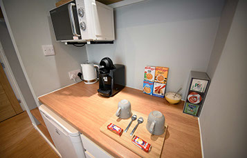 Medina Accommodation contains a Kitchenette with Microwave, Fridge, Freezer and Coffee Machine