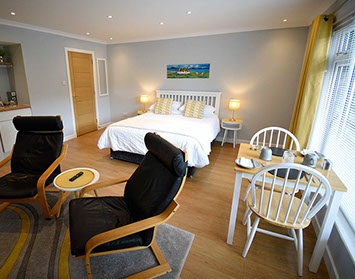 Medina Accommodation in Portree contains a King Size Double Bed and Private Seating Area