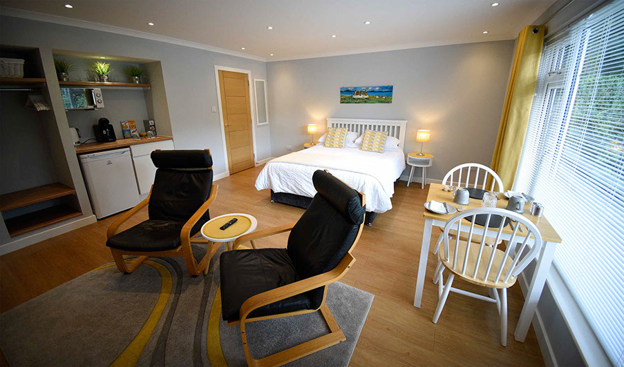 Medina Accommodation in Portree contains a King Size Double Bed and Private Seating Area